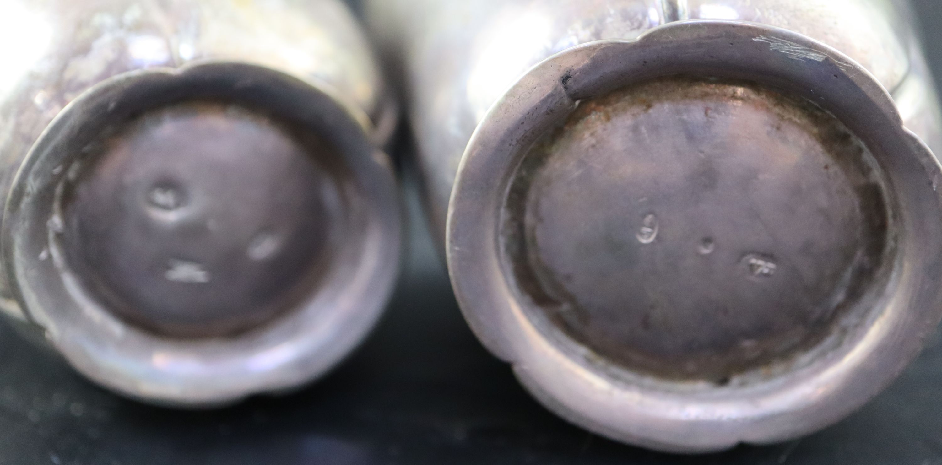 A graduated pair of Continental white metal cusped small vases, tallest 7cm, 215 grams